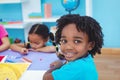 Children drawing on coloured paper Royalty Free Stock Photo