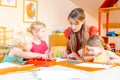 Children drawing in playgroup of nursery school