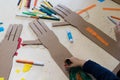 Children is drawing a robotic arm made with cardboard. Cardboard Royalty Free Stock Photo