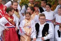 Children dressed in folk costumes go to the church at the Mass on Thanksgiving day in Stitar, Croatia