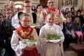 Children dressed in traditional folk costumes in the church at the Mass on Thanksgiving day in Stitar, Croatia