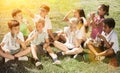 Children drink water from plastic bottles after playing football Royalty Free Stock Photo