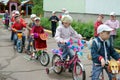 Children driving on designer bicycles and scooters in Russia