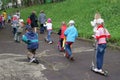 Children driving on scooters in Russia