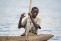 Children in a dugout canoe on Lake Bunyonyi