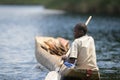 Children in a dugout canoe on Lake Bunyonyi