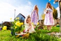 Children on Easter egg hunt with bunny Royalty Free Stock Photo