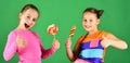 Children eat big colorful sweet caramels. Sisters with lollipops Royalty Free Stock Photo