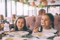 Children eat pasta in family cafe