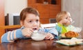 Children eating dairy breakfast