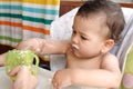 children eating healthy food at home or kindergarten. Happy toddler boy drinking white kefir Royalty Free Stock Photo