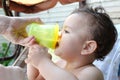 children eating healthy food at home or kindergarten. Happy toddler boy drinking white kefir Royalty Free Stock Photo