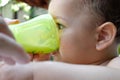 children eating healthy food at home or kindergarten. Happy toddler boy drinking white kefir Royalty Free Stock Photo