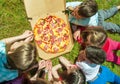Children eating pizza Royalty Free Stock Photo