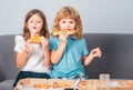 Children eating pizza. Little girl and boy eat pizza. Kids lunch. Royalty Free Stock Photo