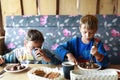 Children eating pork kebab Royalty Free Stock Photo