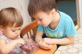 Children eating quick-frozen raspberries