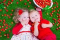 Children eating strawberry Royalty Free Stock Photo