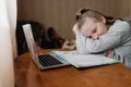 children, education concept - tired schoolboy sleeping at home on table Royalty Free Stock Photo