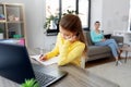 Student girl with laptop learning online at home Royalty Free Stock Photo