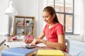 Student girl counting on calculator at home Royalty Free Stock Photo