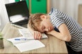 Tired student boy sleeping on desk at home Royalty Free Stock Photo