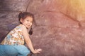 Portrait Cute Little Asian Thai Girl is climbing a cliff. Royalty Free Stock Photo