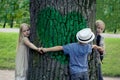 Children embracing tree. Environmental protection outdoor nature. Conservation outdoors Royalty Free Stock Photo