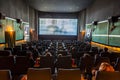 Children enjoy a film at an old traditional cinema