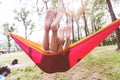 Children enjoy nature relaxing in hammock