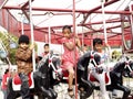 Children enjoying 'The Flying Horse Carousel' Royalty Free Stock Photo