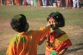 Children are enjoying Holi, the color festival of India.