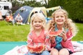 Children Enjoying Picnic Whilst On Family Camping Holiday Royalty Free Stock Photo