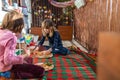 Children enjoying pizza on a balcony