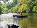 Children are enjoying playing in the water Green nature surrounded at Kaeng Hin Phoeng Rafting Prachin Buri Thailand