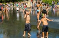 Children enjoying the popular Crown Fountain in Millennium Park in Chicago.