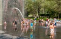 Children enjoying the popular Crown Fountain in Millennium Park on a hot summer day in Chicago Downtown.