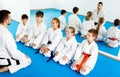 Children enjoying their trainings with coach at karate