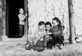 Children from ethnic minorities around with cat