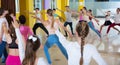 Children exercising in dance hall