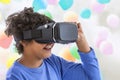 Children experiencing virtual reality video, game ,isolated on white . Surprised little boy looking in VR glasses. Royalty Free Stock Photo