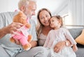 Children, family and teddy bear with a girl and grandparents playing on the sofa during a visit in their home. Kids Royalty Free Stock Photo