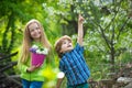 Children farmer concept. Eco living. Happy children farmers having fun on spring field. Children farmer in the farm with Royalty Free Stock Photo