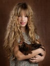 Children fashion farmer girl holding hen retro vintage