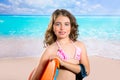 Children fashion surfer girl in tropical turquoise beach