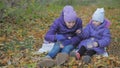 Children feed each other marmalade and cocoa. slow-motion