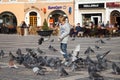 Children feeding pigeons