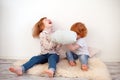 Children fight with pillows Royalty Free Stock Photo