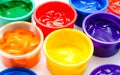 Children finger paint in paintbox Royalty Free Stock Photo