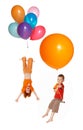 Children fly by balloons